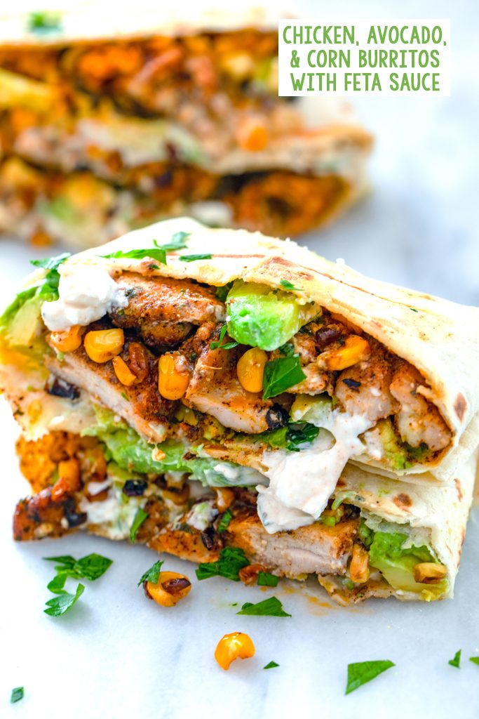 Chicken, avocado, and corn burritos cut in half and stacked on each other to showcase ingredients with feta sauce drizzled on them and recipe title at top