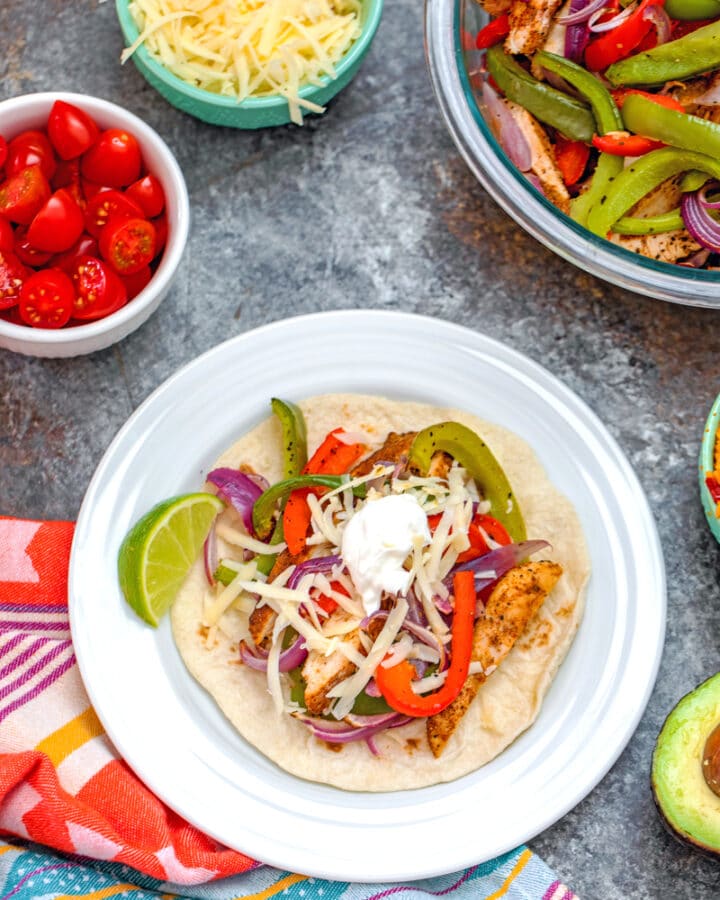 Chicken Fajitas -- You may think fajitas are just a fancy Mexican restaurant meal (that sizzle!). But this recipe for Chicken Fajitas is an incredibly easy dinner anyone can make. Substitute chicken with steak or shrimp if you desire | wearenotmartha.com #chickenfajitas #fajitas #mexicanfood #easydinners #quickdinners