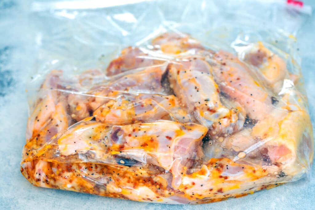 Chicken wings in Ziplock bag with marinade.