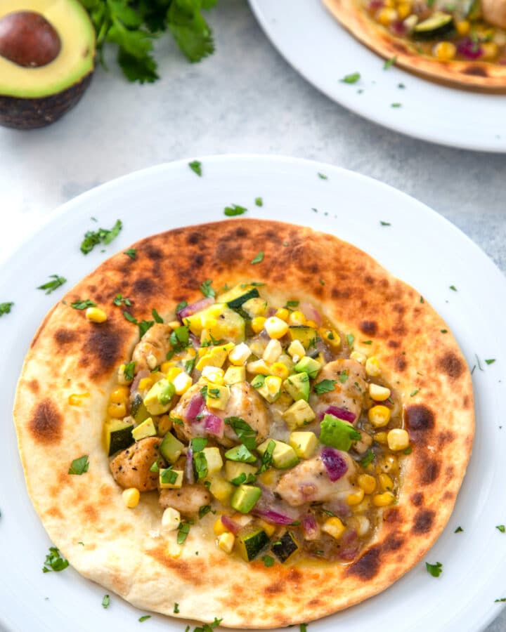 Chicken and Summer Vegetable Tostadas -- These chicken and vegetable tostadas are incredibly easy to make and packed with summer vegetables. And did I mention they go perfectly with a cold glass of white wine? | wearenotmartha.com