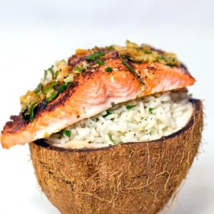 Chili Lime Salmon Over Coconut Rice -- This Chili Lime Salmon Over Coconut Rice is a super simple weeknight dinner that's easy, healthy, and delicious. Serve it in a coconut half if you want to impress, but it's just as tasty on a plate!| wearenotmartha.com