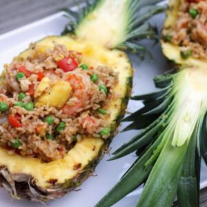 Chili Mango Shrimp Pineapple Fried Rice -- A little bit spicy and a little bit sweet, this Chili Mango Shrimp Pineapple Fried Rice is packed full of flavor and served in a pineapple for some extra tropical fun | wearenotmartha.com