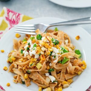 Chipotle Corn Fettuccine -- This pasta brings together the flavors of summer in a deliciously creamy and flavorful dish with a little bit of spice from the chipotle peppers | wearenotmartha.com