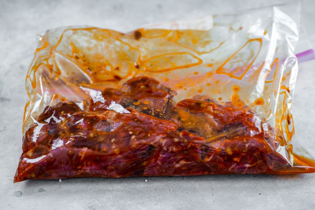 Sirloin marinating in bag with chipotle marinade