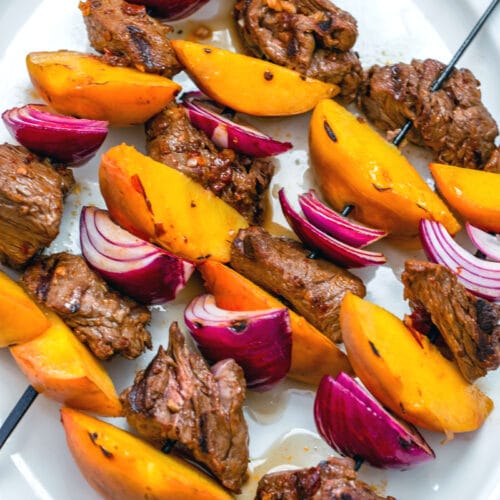 Chipotle Steak and Peach Kabobs -- With a simple (but incredibly flavorful!) marinade and just 10 minutes on the grill, these Chipotle Steak and Peach Kabobs will become your new favorite summer meal! They're perfect for a low-key dinner at home or for outdoor entertaining with friends | wearenotmartha.com #sirloin #kabobs #grillingrecipes #steakkabobs #peaches