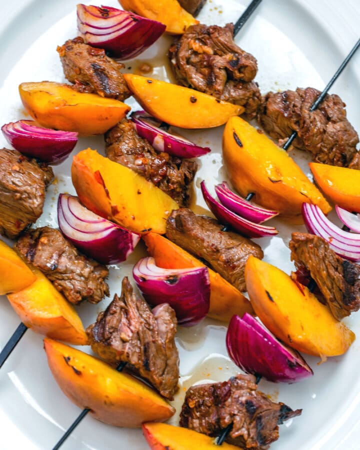 Chipotle Steak and Peach Kabobs -- With a simple (but incredibly flavorful!) marinade and just 10 minutes on the grill, these Chipotle Steak and Peach Kabobs will become your new favorite summer meal! They're perfect for a low-key dinner at home or for outdoor entertaining with friends | wearenotmartha.com #sirloin #kabobs #grillingrecipes #steakkabobs #peaches