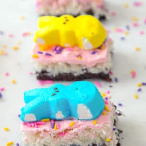 Chocolate Brownie Coconut Peeps Bars -- This layered bar has a chocolate brownie base, a layer of sweet coconut, a white chocolate topping, and plenty of Peeps and sprinkles. Whether you're making them for Easter or just a spring celebration, these Peeps bars are sure to delight! | wearenotmartha.com