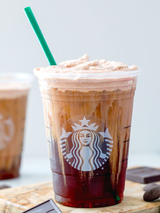 Head-on view of chocolate cream cold brew in Starbucks cup.