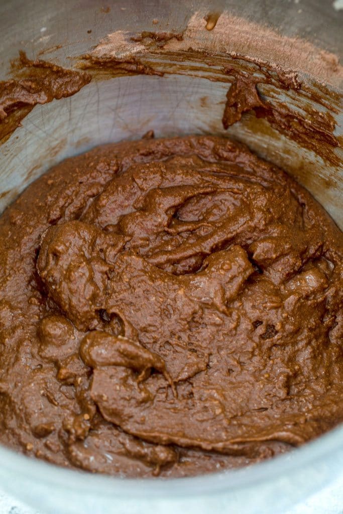 Overhead view of a bowl of batter for chocolate mint chocolate chip cupcakes
