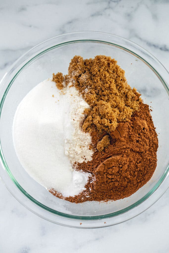 Flour, granulated sugar, brown sugar, and cocoa powder in bowl
