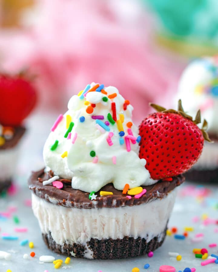 Chocolate Strawberry Ice Cream Cupcakes -- With a cookie crust, strawberry ice cream middle, and fudge and whipped cream topping, these little Chocolate Strawberry Ice Cream Cupcakes are the best summer party treats! | wearenotmartha.com #icecream #icecreamcake #cupcakes #summerdesserts #chocolatestrawberry
