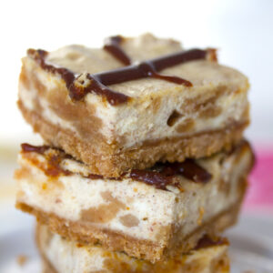 Cinnamon Bun Oreo Cheesecake Bars -- An Oreo cookie crust and cookie-filled cheesecake filling combine for a delicious dessert bar | wearenotmartha.com