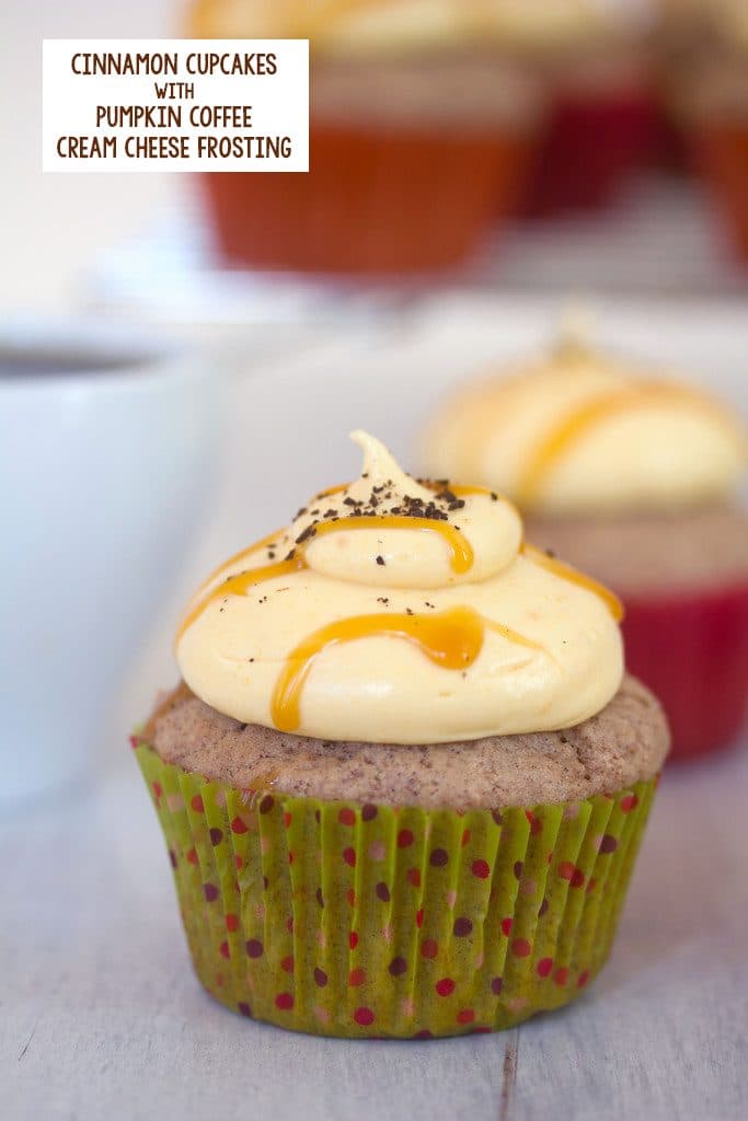 Head-on close-up view of a cinnamon cupcake with pumpkin coffee cream cheese frosting and a caramel drizzle with recipe title at top