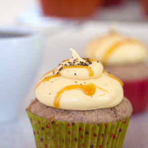 Cinnamon Cupcakes with Pumpkin Coffee Cream Cheese Frosting -- These cinnamon cupcakes are filled and topped with a pumpkin coffee cream cheese frosting that will have you licking the bowl clean! | wearenotmartha.com