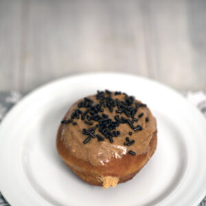 Cinnamon Peanut Butter Doughnuts -- Deliciously fried donuts filled with peanut butter cream and topped with a cinnamon peanut butter glaze | wearenotmartha.com