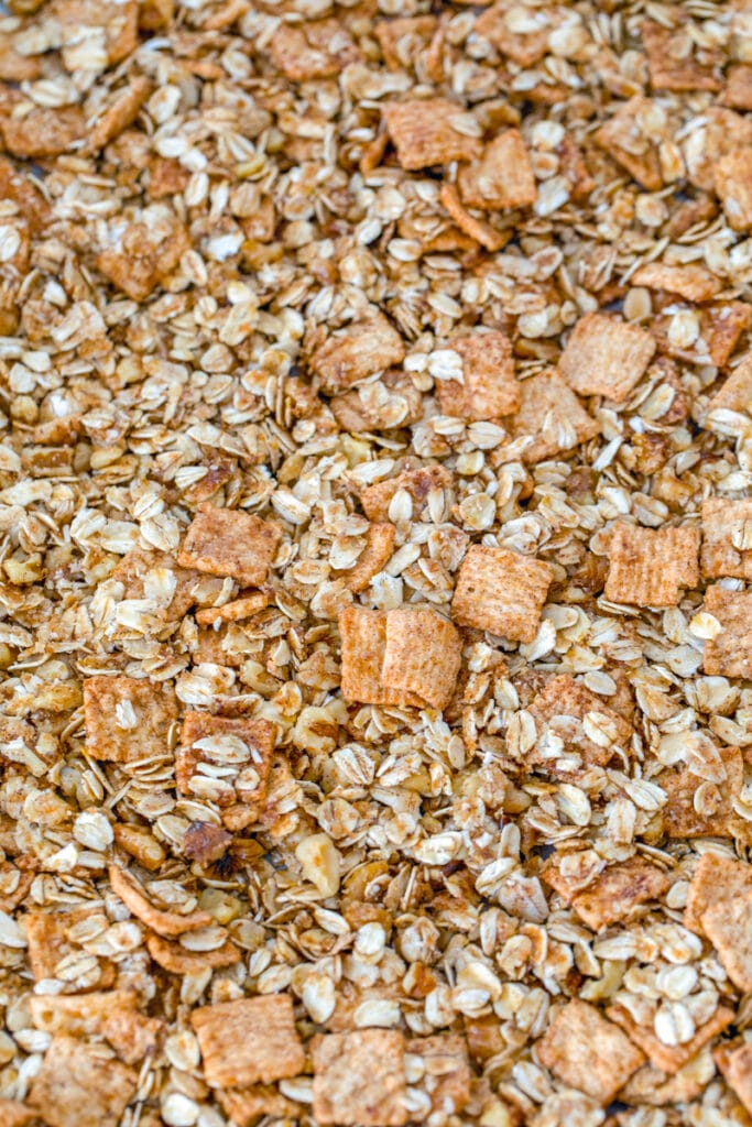 Overhead view of granola ingredients spread out on baking sheet