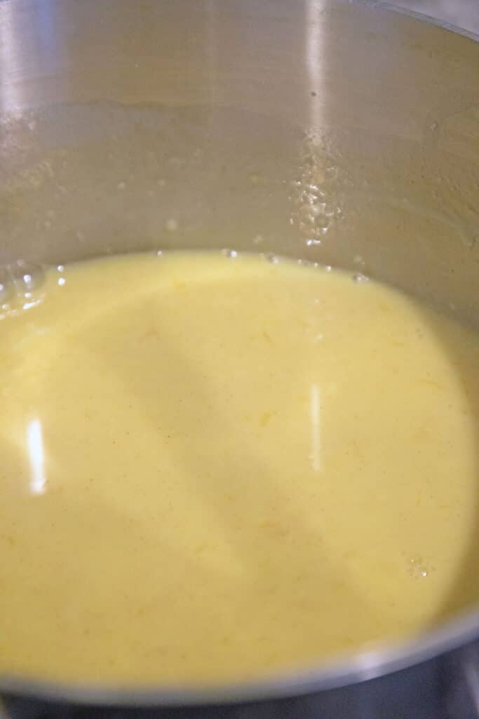 Milk and egg yolks in saucepan.