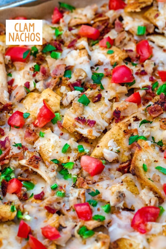 overhead close-up view of clam nachos with jalapeño, tomato, and bacon with recipe title at top