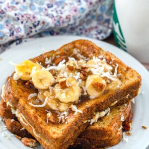 Whole Wheat Coconut French Toast with Banana Pecan Caramel Sauce -- This whole wheat coconut french toast is already plenty delicious, but drizzle on that banana pecan caramel sauce and omg, it's the most heavenly brunch! | wearenotmartha.com #brunch #breakfast #frenchtoast #coconut