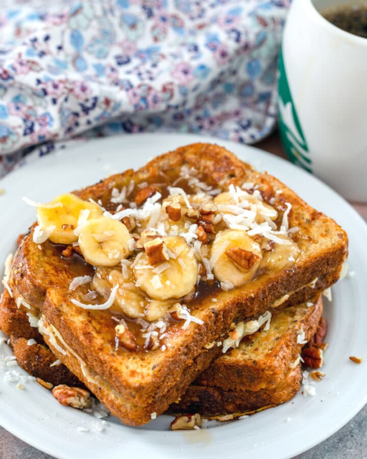 Whole Wheat Coconut French Toast with Banana Pecan Caramel Sauce -- This whole wheat coconut french toast is already plenty delicious, but drizzle on that banana pecan caramel sauce and omg, it's the most heavenly brunch! | wearenotmartha.com #brunch #breakfast #frenchtoast #coconut