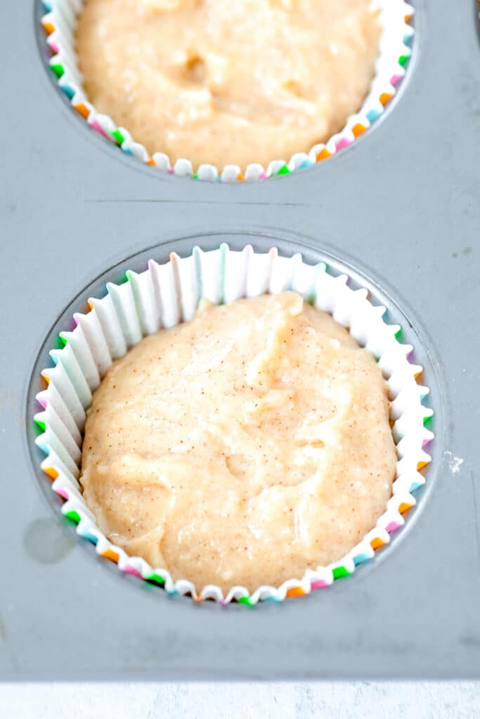 Cupcake papers filled with batter