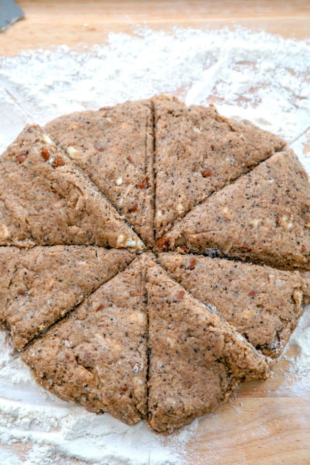 Scone batter formed into a round on a floured surface and sliced into 8 wedges