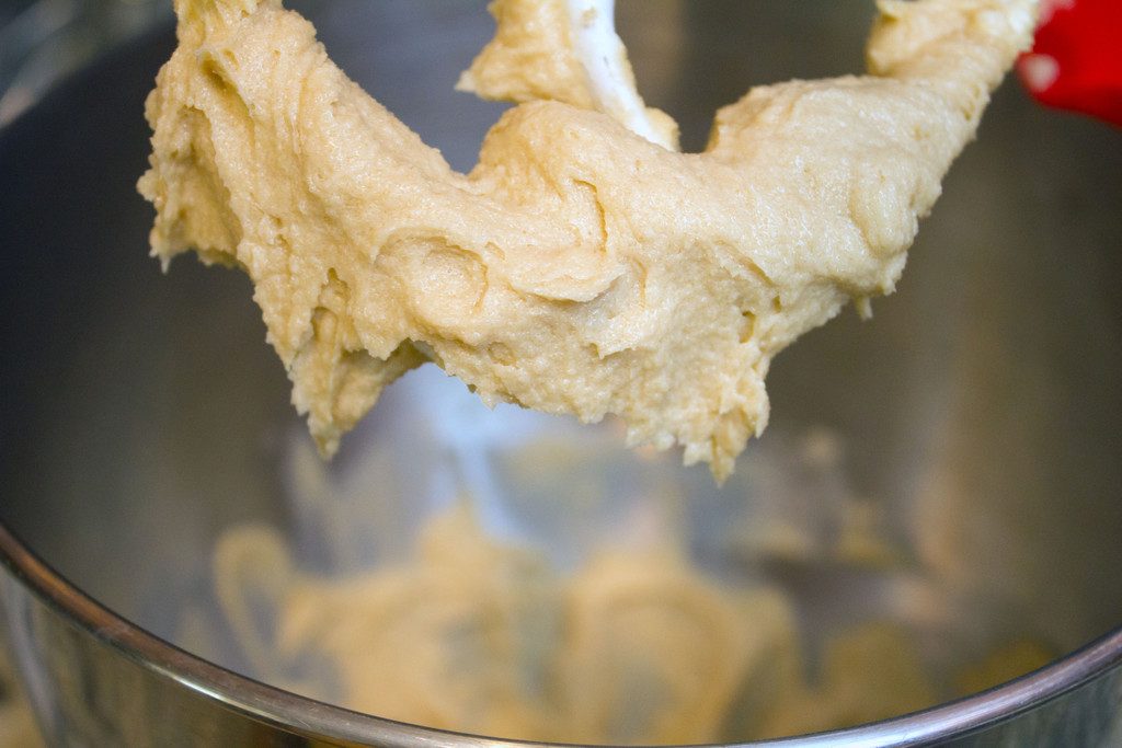 Image showing edible cookie dough on stand mixer paddle.