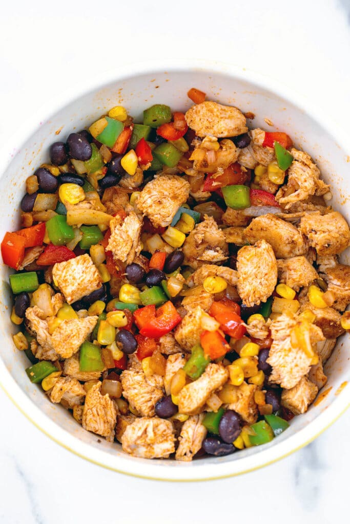 Chicken and vegetable mixture for quesadillas in a bowl.