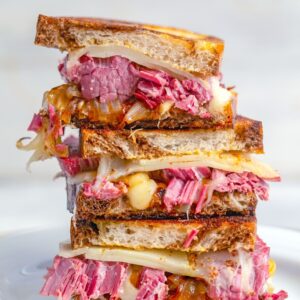 These Corned Beef Melts are the perfect solution to your St. Patrick's Day leftovers. But they're so delicious, they'll have you making corned beef just so you can enjoy these sandwiches!