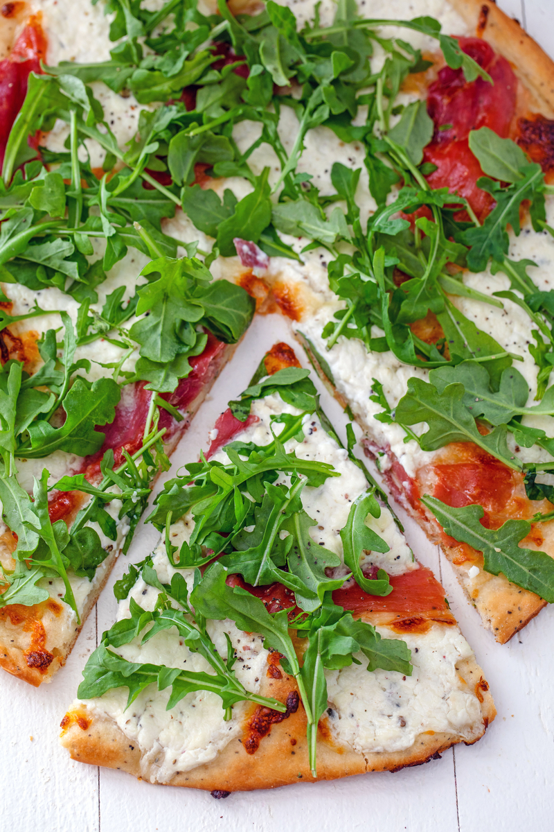 Cottage cheese and pizza are a match made in heaven! This Cracked Pepper Cottage Cheese Pizza with Prosciutto and Arugula makes a delicious anytime dinner, but can also be served as a party appetizer.