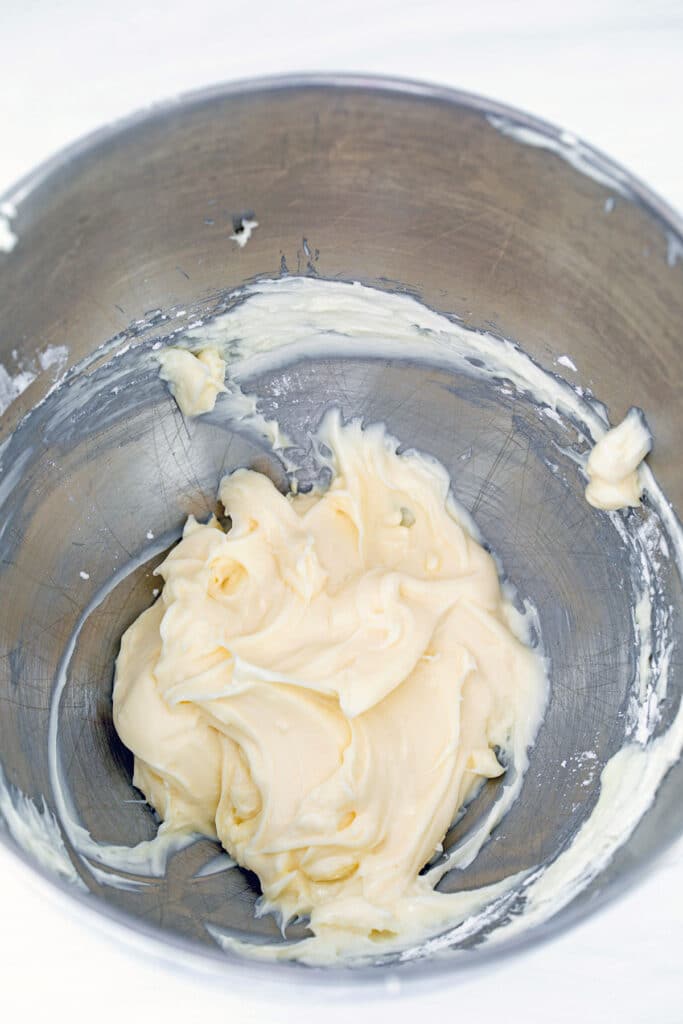 Overhead view of cream cheese filling in a bowl.