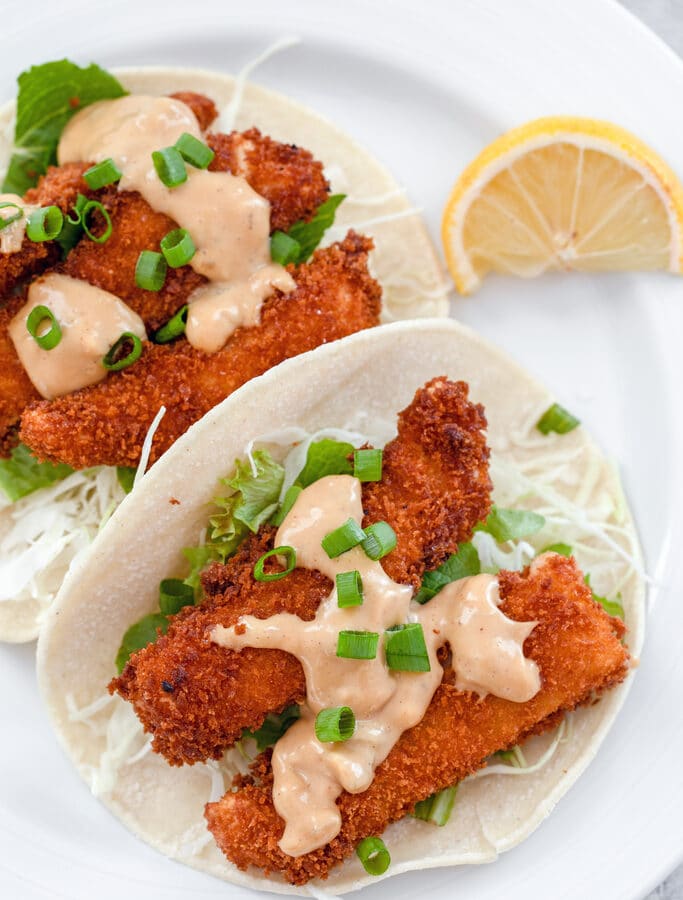Crispy Fried Fish Tacos -- These Crispy Fried Fish Tacos are served with a delicious hoisin mayo sauce and green cabbage and are so, so easy to make at home! | wearenotmartha.com
