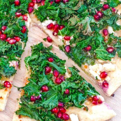 Crispy Kale, Habanero, and Pomegranate Flatbread -- This crispy kale flatbread is topped with spicy habanero peppers, pomegranate arils, feta cheese, and honey for an incredibly unique and totally mind-blowing flavor combination | wearenotmartha.com
