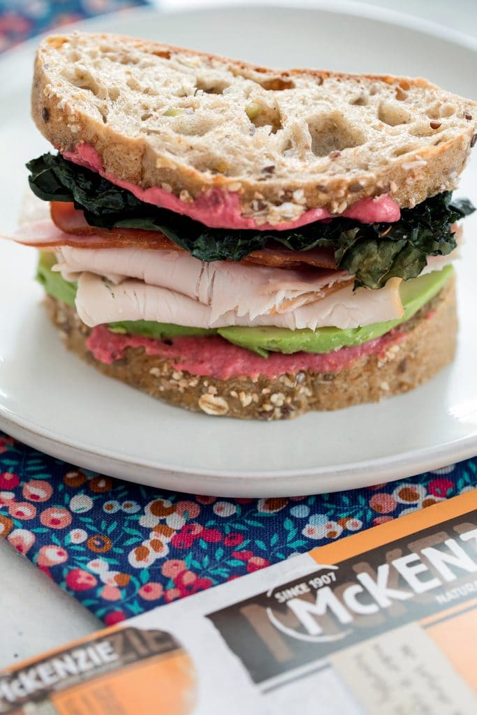 Crispy Kale Turkey and Ham Sandwiches with Beet Mayo -- These sandwiches contain all the components of a perfect sandwich: Great bread, a delicious spread, a little crunch, and really good natural deli meat | wearenotmartha.com