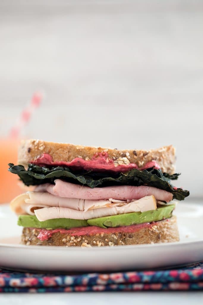 Crispy Kale Turkey and Ham Sandwiches with Beet Mayo -- These sandwiches contain all the components of a perfect sandwich: Great bread, a delicious spread, a little crunch, and really good natural deli meat | wearenotmartha.com