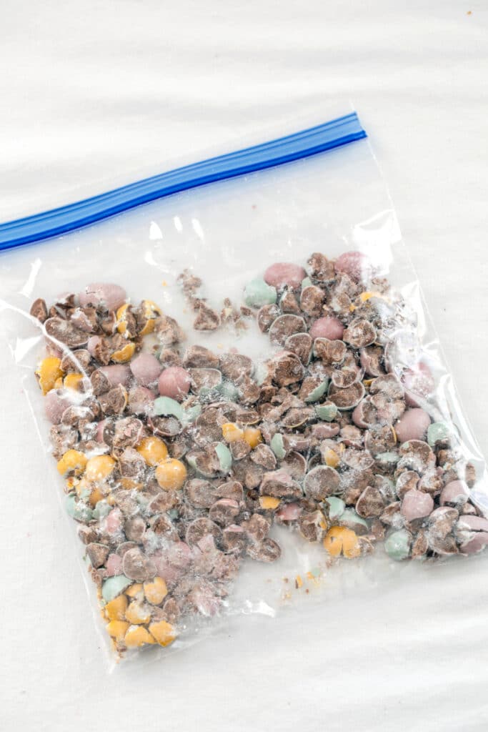 Overhead view of Cadbury Mini Eggs crushed in a bag