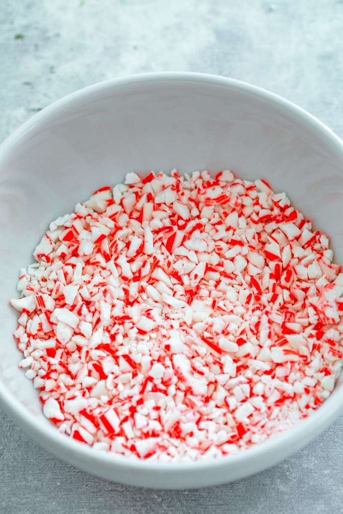 Overhead of a white bowl of crushed candy canes