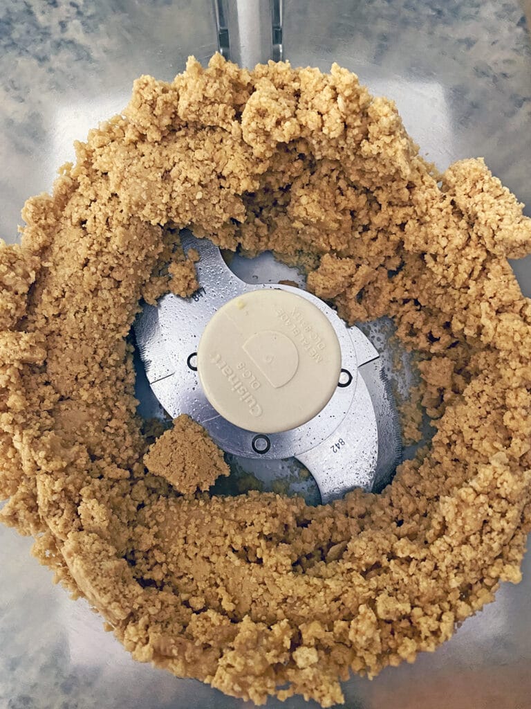 Overhead view of lemon Oreo cookies processed with butter in food processor