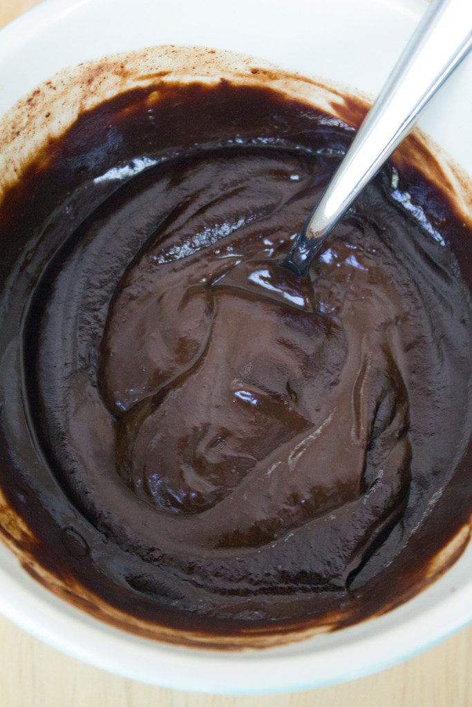 Overhead view of dark chocolate pudding thickened in bowl