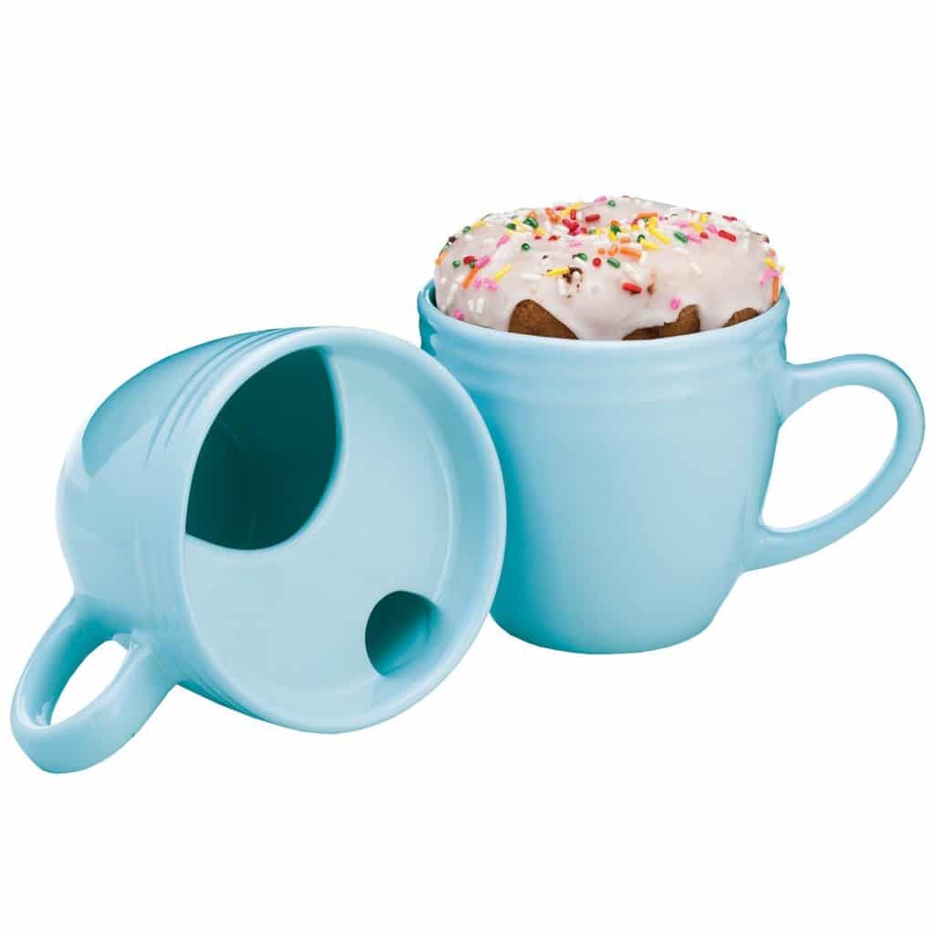 Donut warming coffee mug with donut sitting on top