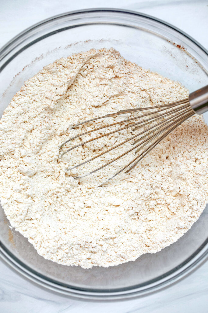 Bowl of fry ingredients for cookies with whisk.