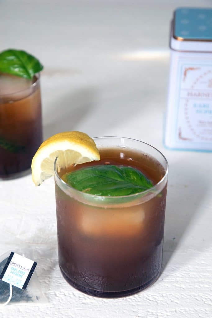 Earl Grey Vodka Cocktail -- This cocktail mixes tea-infused vodka with cranberry juice, lemon juice, and smashed basil for a simultaneously refreshing and warming drink | wearenotmartha.com