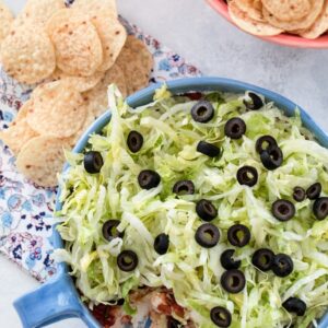 Easy Taco Dip -- There's nothing fancy about this taco dip, but it will take you five minutes to put together and will likely be the hit of the party. With just five ingredients, all of your friends will be asking for the recipe | wearenotmartha.com