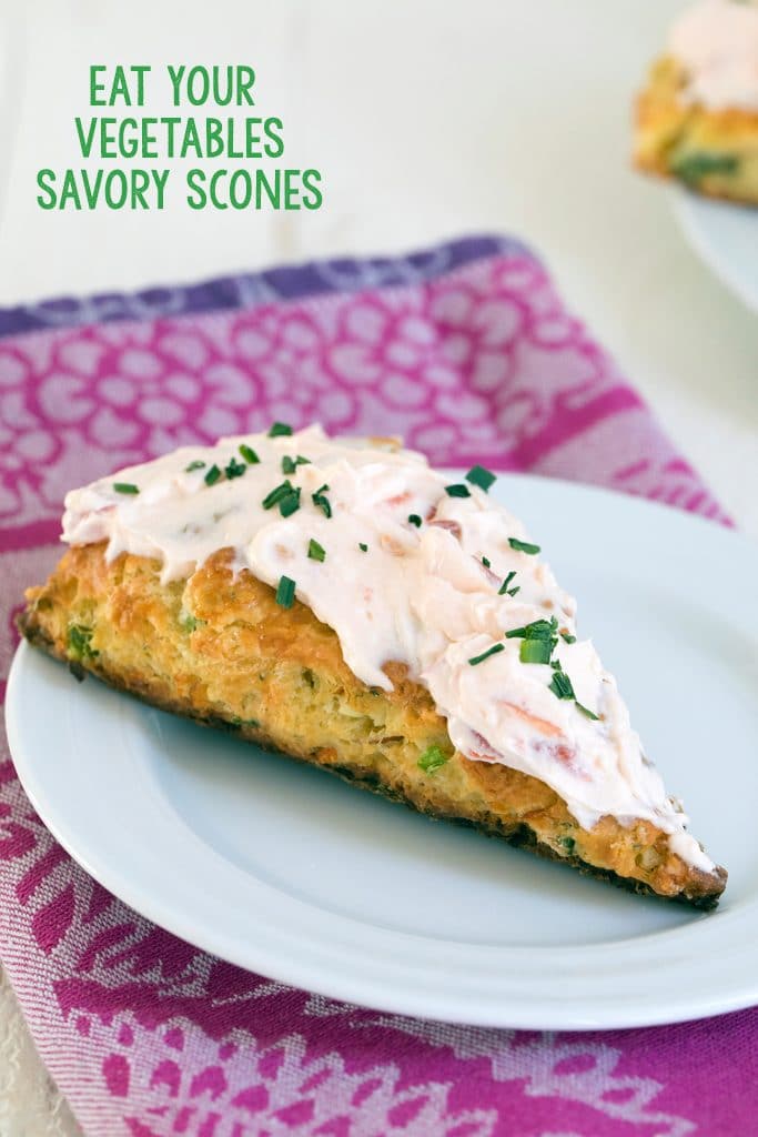 Eat Your Vegetables Savory Scones -- These Savory Scones can be made with any vegetables or cheese you need to use up in your fridge. This version uses carrots, kale, bell peppers, and feta with a savory tomato cream cheese icing as the perfect topping | wearenotmartha.com