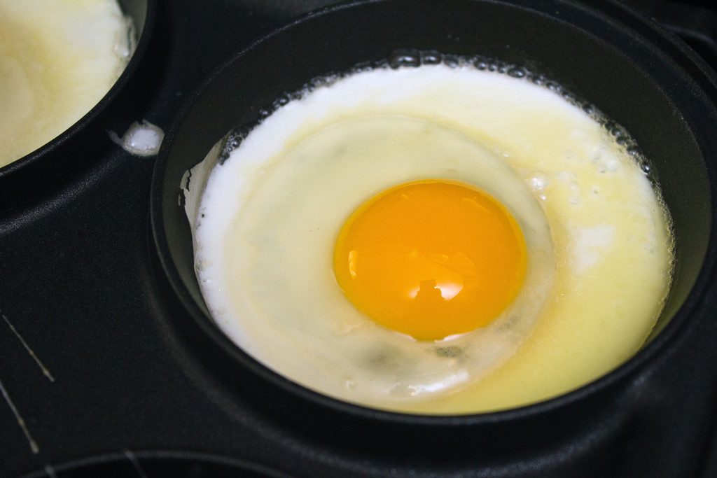 View of sunny-side up egg cooking in pan