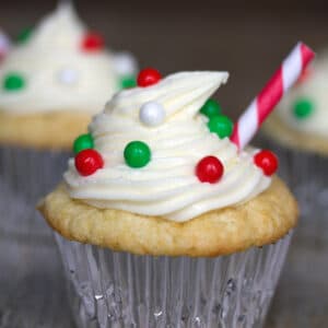 Eggnog Cupcakes with Peanut Butter Cups -- Eggnog season is so short, you need to take advantage of it while you can! These Eggnog Cupcakes have a little surprise inside... a peanut butter cup! They'll make you realize that eggnog and peanut butter (with a touch of chocolate) are an amazing combination! | wearenotmartha.com