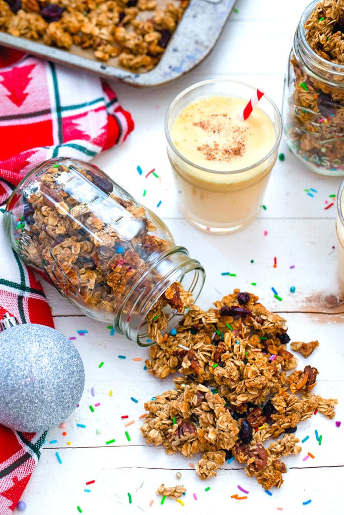 Close-up of eggnog granola spilling out of mason jar