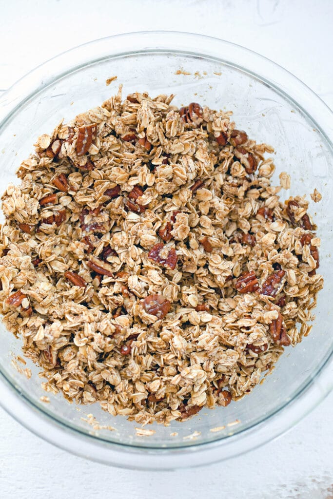 Oat mixture coated in eggnog mixture in large bowl