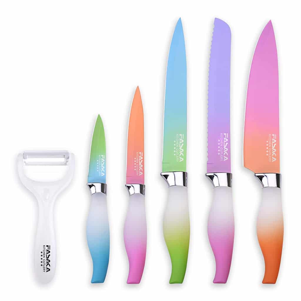 Row of five ombre rainbow colored knives with vegetable peeler