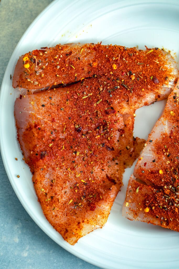 Barramundi fish with cajun spices rubbed onto it